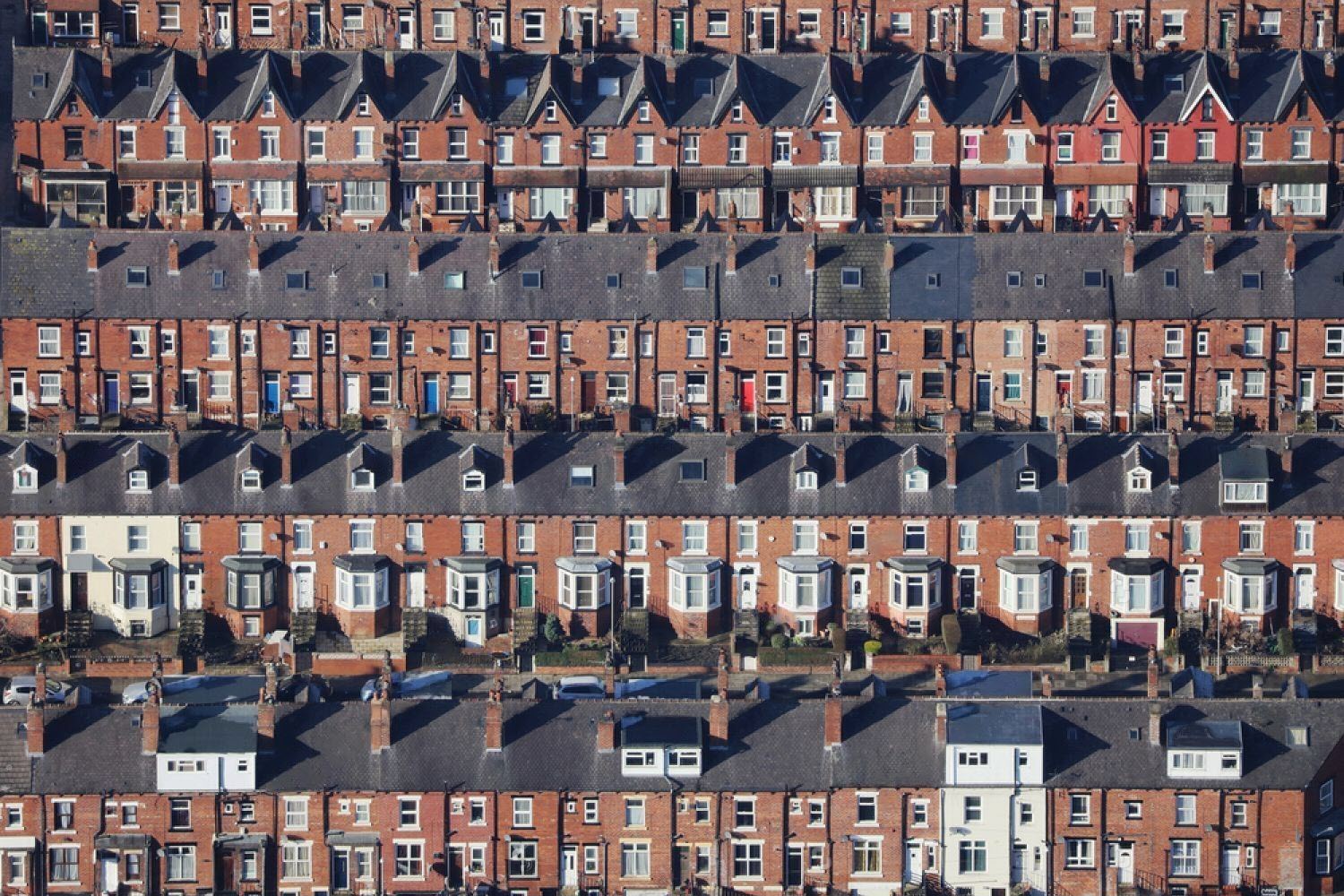 stock-photo-an-aerial-view-taken-from-a-helicopter-of-suburban-terraced-streets-and-roads-in-britain-many-1723048141-transformed